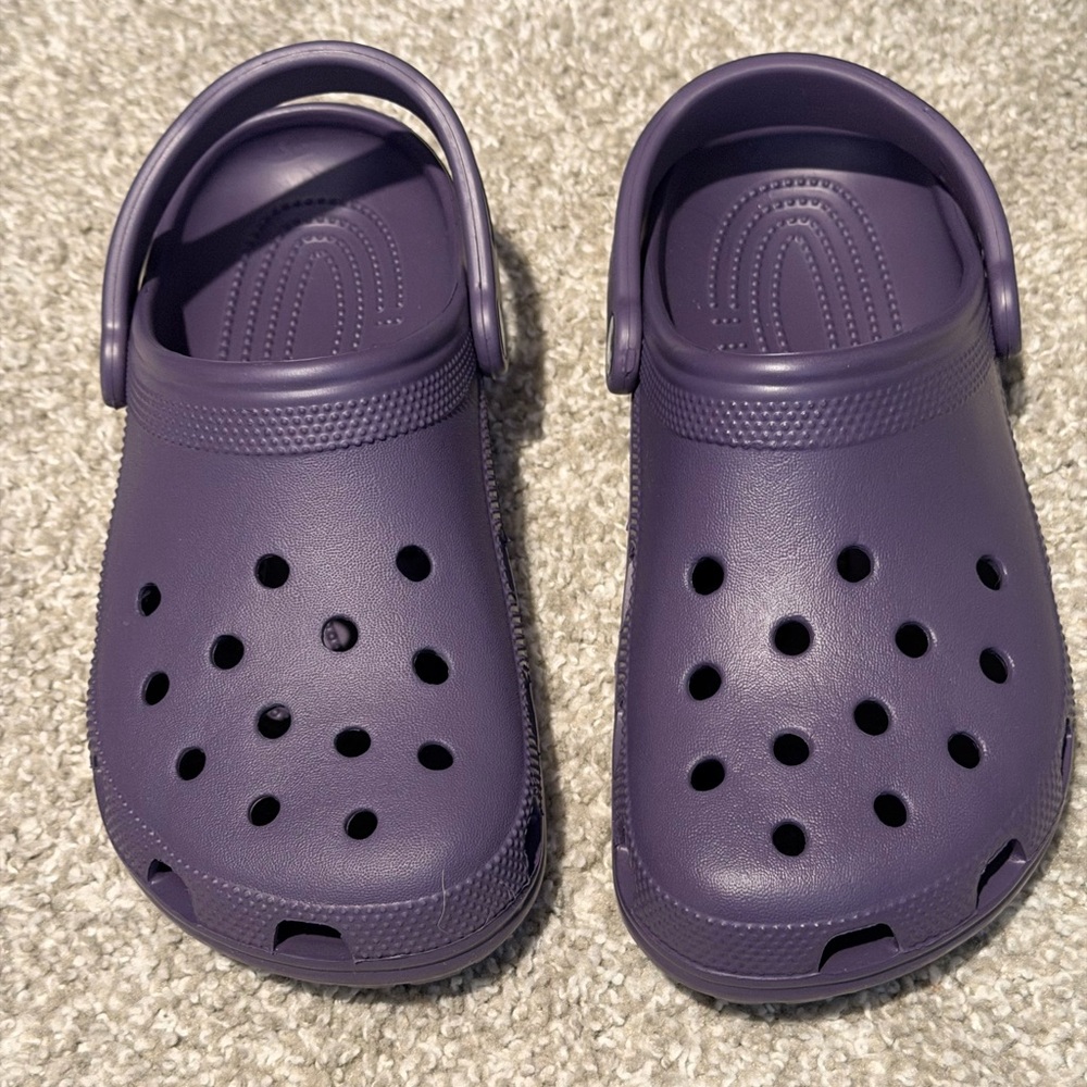 Crocs Purple Clogs NWOT never worn, brand new! With two pairs of socks! NEW!